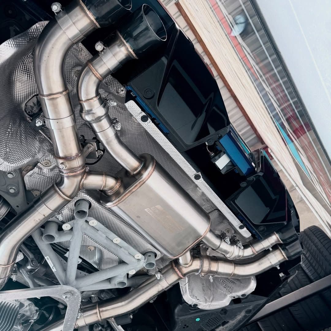 Titanium Z-pipe exhaust detail on a BMW G90 M5